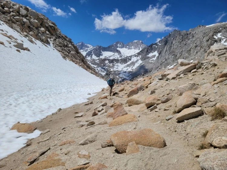 Snow beside the rocky trail to Mono Pass.