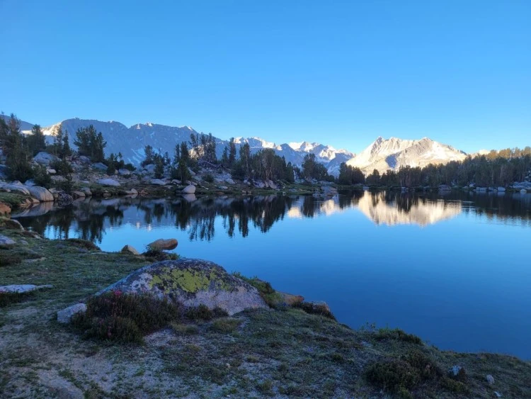 Still morning water reflecting the peaks of Fourth Recess.